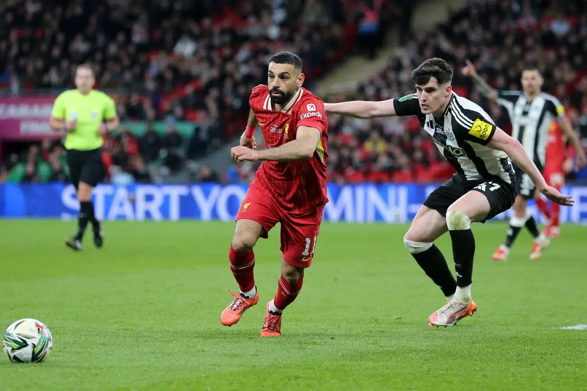 Mohamed Salah of Liverpool and Tino Livramento of Newcastle United in action.